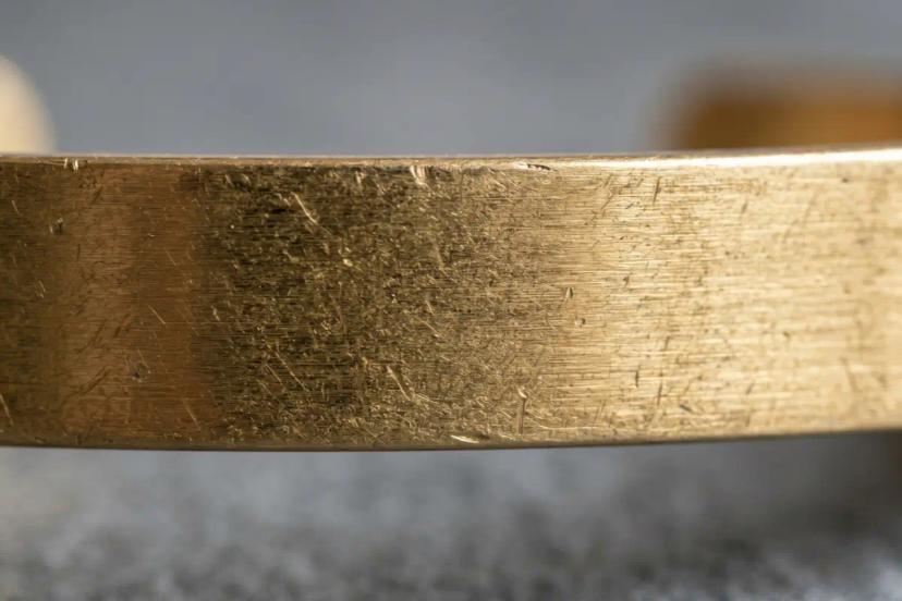 Close-up texture of 316L stainless steel used in durable hypoallergenic jewelry manufacturing