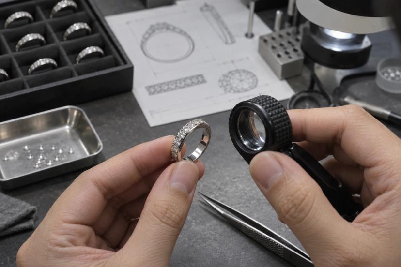 Jewelry quality control inspection of stone setting on a custom stainless steel ring