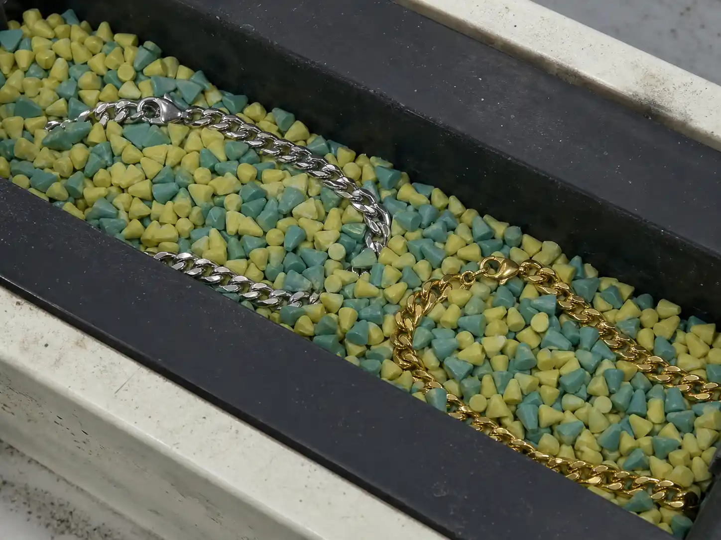 gold PVD necklace in ceramic media for wear resistance testing